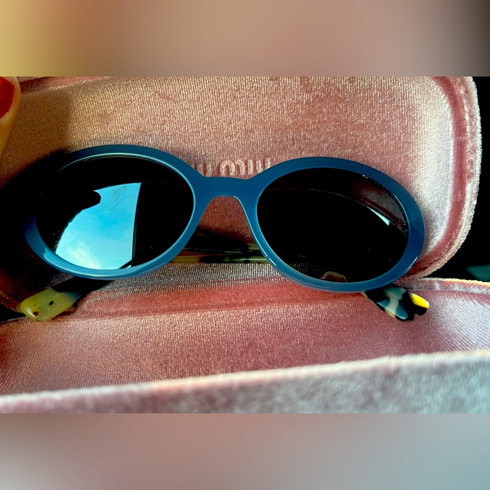 Miu Miu Women’s sunglasses.